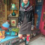 MYSTREE gray thermal dress, $65, black vegan leather jacket by SISTERS, $106, Frida knee highs, $10, SHUPACA alpaca knit gray hat, $43.50, and fingerless gloves, $48, Indian woven scarf, $12