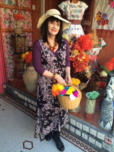 Floral duster by CLICHE, $77, straw hat by JEANNE SIMMONS, $14.50