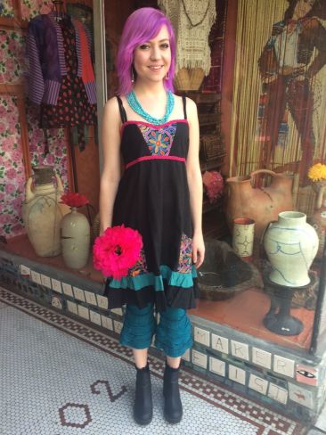 Black embroidered sundress by JEDZEBEL, $59, with teal ruffled leggings, $48