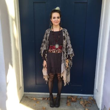 Elephant print kimono-style poncho by ANGIE, $35. Black MONORENO dress, $58. Chacha necklacel, $450
Vintage woven Peruvian belt, $110
