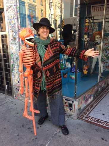 Woven sweater jacket by FASHION FUSE, $43.50. Black felt rimmed hat with feathers, $41. Green scarf by SHIHREEN, $22
