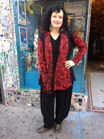 Red and black hand-crafted Peruvian sweater by TEY-ART, $192, black top by TIENDA HO, $115; black pants by TIENDA HO, $125