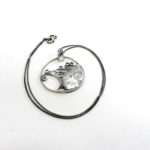 Roman glass circular pendant with chain, $115. Photo by Jessica Laudicina.